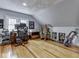 Well-lit office featuring hardwood floors, a large desk, and a comfortable seating area at 57 Worman St, Indianapolis, IN 46227