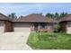 Charming single story brick home featuring a manicured lawn and attached garage at 572 Eagle Crest Dr, Brownsburg, IN 46112
