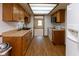 Functional kitchen featuring wood-look flooring and ample cabinet space at 572 Eagle Crest Dr, Brownsburg, IN 46112