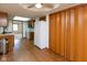 The kitchen features wood cabinets, laminate floors and a white refrigerator at 572 Eagle Crest Dr, Brownsburg, IN 46112