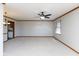 Bright living room with ceiling fan, neutral walls, and views to the kitchen at 572 Eagle Crest Dr, Brownsburg, IN 46112