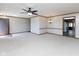 Open-concept living room with views to the entrance, kitchen, and dining space at 572 Eagle Crest Dr, Brownsburg, IN 46112