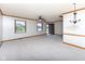Large living room with neutral carpet and views to the front yard at 572 Eagle Crest Dr, Brownsburg, IN 46112