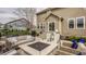 Backyard patio features outdoor seating around a fire pit in a cozy setting at 5869 Belchamp Dr, Noblesville, IN 46062