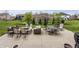 Outdoor patio featuring a fire pit, outdoor seating, dining table, and beautiful backyard at 5869 Belchamp Dr, Noblesville, IN 46062