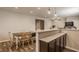 Finished basement featuring a bar area, dining table, and exercise equipment at 5869 Belchamp Dr, Noblesville, IN 46062