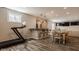 Finished basement with dining area, treadmill, bar, tile flooring, and recessed lighting at 5869 Belchamp Dr, Noblesville, IN 46062