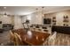 Finished basement with dining table, bar, treadmill, and tile flooring at 5869 Belchamp Dr, Noblesville, IN 46062
