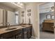Bathroom featuring a double sink vanity with a view into a bedroom at 5869 Belchamp Dr, Noblesville, IN 46062