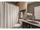 Neutral bathroom with shower and dark wood vanity with stone countertop at 5869 Belchamp Dr, Noblesville, IN 46062