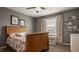 Bedroom featuring neutral walls, a wooden bed, and open shelving at 5869 Belchamp Dr, Noblesville, IN 46062