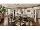 Open concept dining area with stainless steel appliances, granite countertops, and hardwood floors at 5869 Belchamp Dr, Noblesville, IN 46062