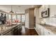 Stylish kitchen featuring granite countertops, stainless steel appliances, and hardwood floors at 5869 Belchamp Dr, Noblesville, IN 46062