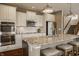 Spacious kitchen with a large island, modern appliances, and seamless flow to the dining area at 5869 Belchamp Dr, Noblesville, IN 46062