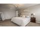 Cozy main bedroom featuring soft neutral colors, carpet, and decorative lighting at 5869 Belchamp Dr, Noblesville, IN 46062