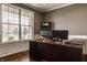 Bright office with large windows, custom desk, and hardwood floors at 5869 Belchamp Dr, Noblesville, IN 46062