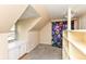 Carpeted attic space with built-in storage and a window seat at 590 N 17Th St, Noblesville, IN 46060