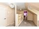 Attic space with built in storage, sloped ceilings, and a unique light fixture at 590 N 17Th St, Noblesville, IN 46060
