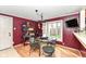 Dining area features a modern chandelier, large bay window, and seating for four at 590 N 17Th St, Noblesville, IN 46060