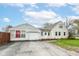 Charming home with a spacious driveway, attached garage, and a well-maintained front yard at 590 N 17Th St, Noblesville, IN 46060