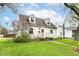 Charming two-story home with dormer windows, a cozy porch, and a well-maintained front lawn at 590 N 17Th St, Noblesville, IN 46060