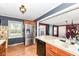 Bright kitchen with stainless steel refrigerator, breakfast bar, and easy access to the dining area at 590 N 17Th St, Noblesville, IN 46060