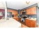 Functional kitchen with wood cabinets, laminate countertops, and stainless steel appliances at 590 N 17Th St, Noblesville, IN 46060