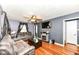 Cozy living room with hardwood floors, a stone fireplace, and comfortable seating at 590 N 17Th St, Noblesville, IN 46060