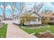 This property showcases a well-kept lawn, a concrete driveway, and a quaint porch, perfect for relaxation at 5942 Primrose Ave, Indianapolis, IN 46220