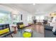 Inviting living room with hardwood floors, modern decor, and large windows that brighten the space at 5942 Primrose Ave, Indianapolis, IN 46220