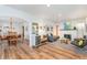 Open-concept living room featuring hardwood floors, stylish furniture, and an inviting atmosphere at 5942 Primrose Ave, Indianapolis, IN 46220