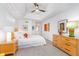 A spacious and well-lit main bedroom features a ceiling fan, ensuite access and natural light at 5942 Primrose Ave, Indianapolis, IN 46220