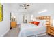 Bright and airy main bedroom features a ceiling fan, ensuite access and natural light at 5942 Primrose Ave, Indianapolis, IN 46220
