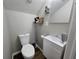 Modern bathroom with white vanity, sleek sink, and toilet, perfect for a stylish and functional space at 599 Cielo Vista Dr, Greenwood, IN 46143