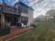 Exterior shot of a two-story home with a private balcony and deck, enhanced by a well-maintained lawn at 599 Cielo Vista Dr, Greenwood, IN 46143