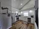 Bright kitchen with stainless steel appliances, wooden floors, and gray countertops at 599 Cielo Vista Dr, Greenwood, IN 46143
