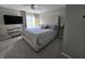 Comfortable main bedroom with tufted headboard, large window, and ceiling fan at 599 Cielo Vista Dr, Greenwood, IN 46143