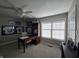 Well lit home office featuring Colts memorabilia, desk and ceiling fan at 599 Cielo Vista Dr, Greenwood, IN 46143