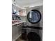 Pantry room with white shelving fully stocked with a stainless steel washer and dryer at 599 Cielo Vista Dr, Greenwood, IN 46143
