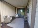 Cozy covered patio featuring comfortable seating, a sliding glass door, and an outdoor entertainment area at 599 Cielo Vista Dr, Greenwood, IN 46143