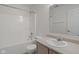 Clean bathroom featuring a shower-tub combination, single sink vanity, and tile floor at 6846 Emerald Bay Ln, Indianapolis, IN 46237