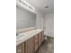 Well-lit bathroom featuring a double sink vanity, tile floor, and shower-tub combination at 6846 Emerald Bay Ln, Indianapolis, IN 46237