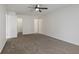 Bedroom with neutral carpeting, a ceiling fan, and multiple entryways that offer easy access at 6846 Emerald Bay Ln, Indianapolis, IN 46237