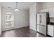 Cozy dining area with natural light and stainless steel refrigerator, great for Gathering meals at 6846 Emerald Bay Ln, Indianapolis, IN 46237
