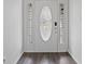 Elegant front door with decorative glass and sidelights, adding a touch of sophistication at 6846 Emerald Bay Ln, Indianapolis, IN 46237