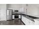 Bright kitchen with stainless steel appliances, granite countertops, and ample cabinet space at 6846 Emerald Bay Ln, Indianapolis, IN 46237