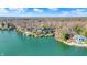 Beautiful aerial view of lakefront houses with lake access and surrounded by lush trees at 7003 Eagle Dr, Nineveh, IN 46164