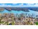 Aerial view showcasing the lake community and homes nestled among lush trees and winding shorelines at 7003 Eagle Dr, Nineveh, IN 46164