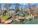 Picturesque lakefront property with charming blue two-story home, private docks, and scenic water views at 7003 Eagle Dr, Nineveh, IN 46164