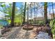 Outdoor space featuring a charming fire pit and stone patio is ideal for gathering and enjoying the outdoors at 7003 Eagle Dr, Nineveh, IN 46164